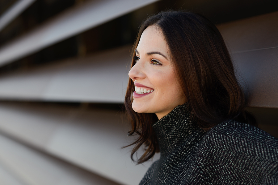 A woman smiles, showing a youthful appearance. Botox treatment can give you a younger-looking appearance.